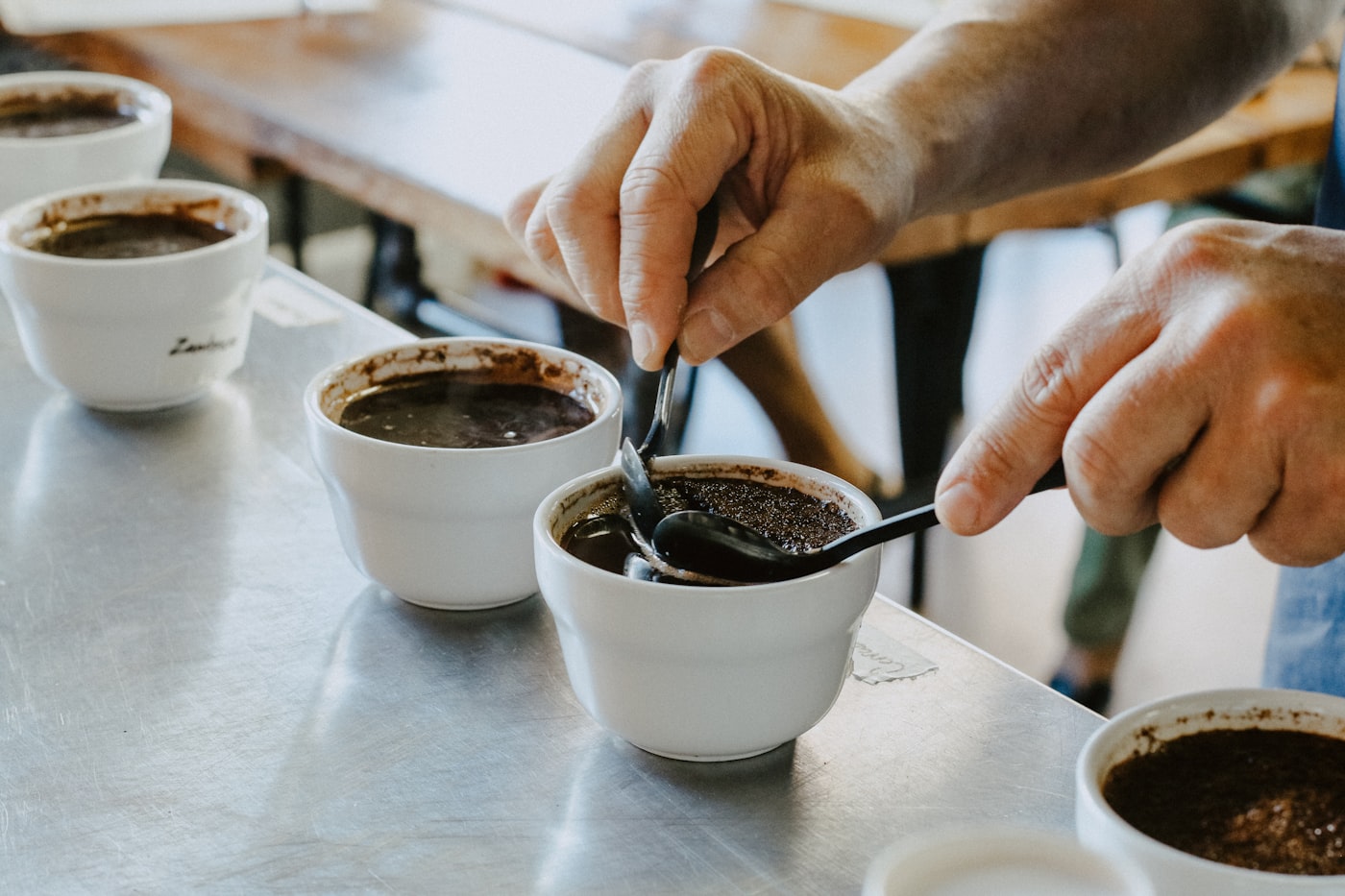 Cups arranged for a cupping session, being evaluated
